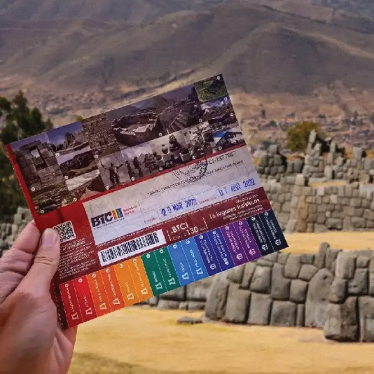 Cusco tourist ticket with Saqsaywaman in the background.