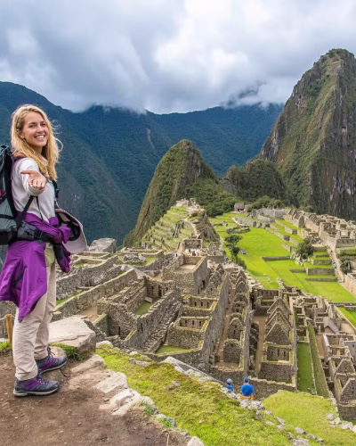 On the trail from Lares to Machu Picchu, girl with her llamas.