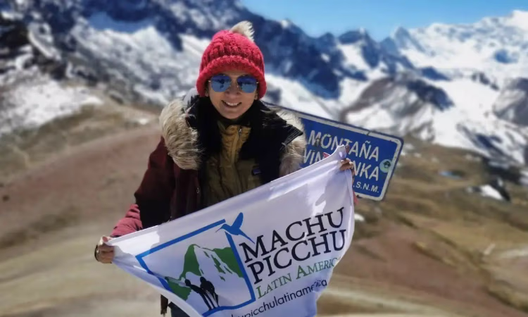 On the trail from Lares to Machu Picchu, girl with her llamas.